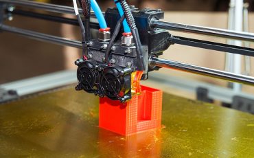 3D printer creating an educational model in a school lab