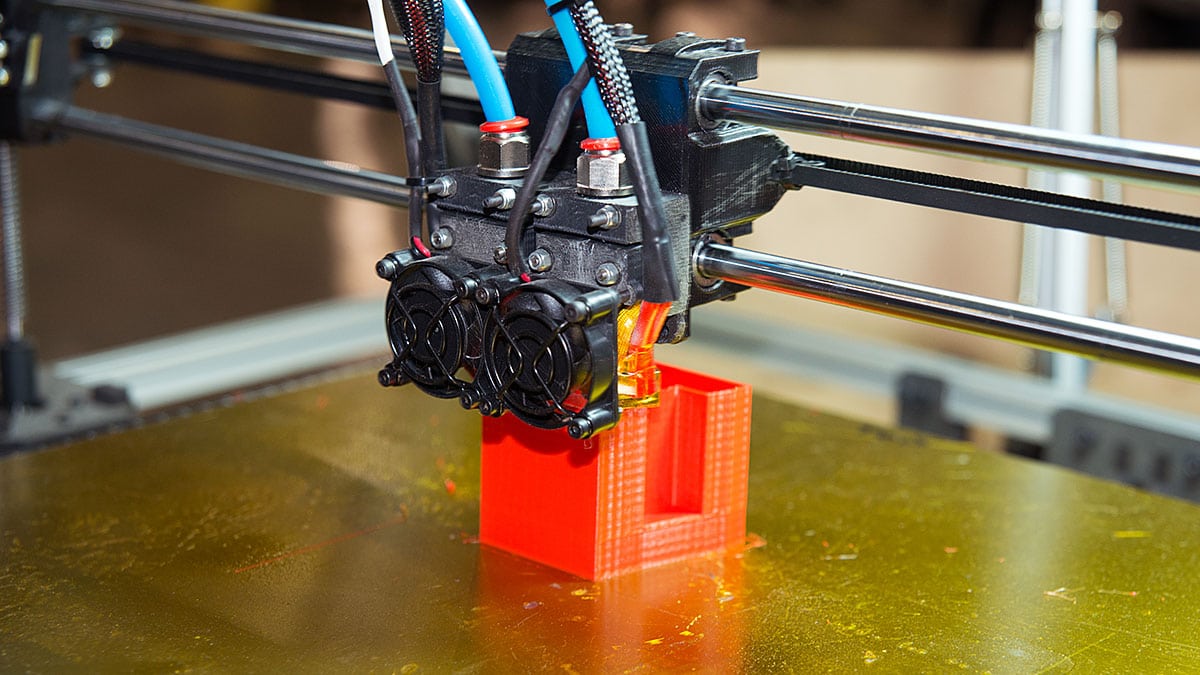 3D printer creating an educational model in a school lab