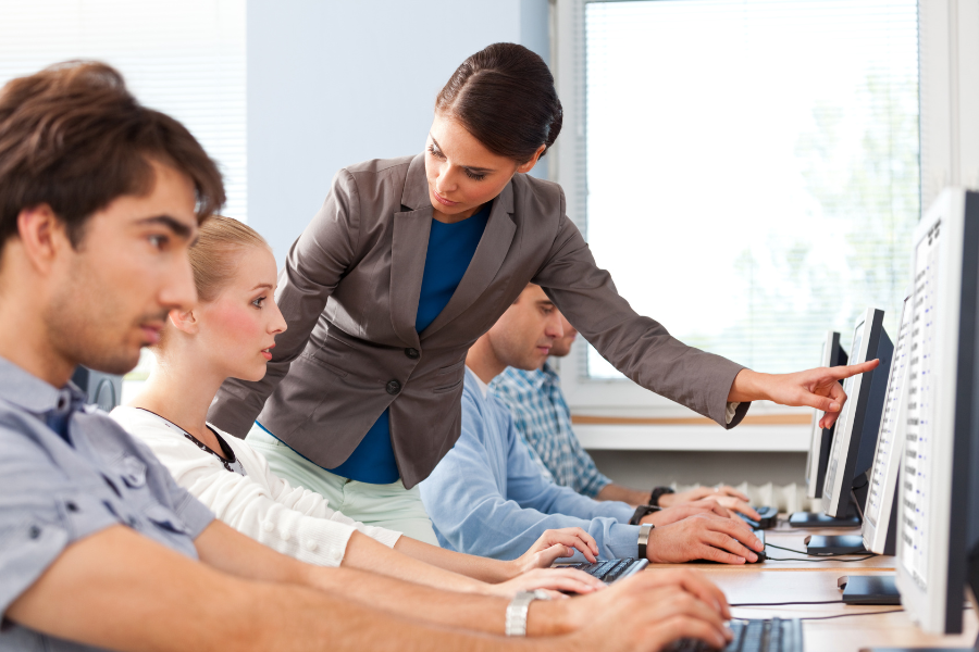 Student attending an online database course via virtual classroom